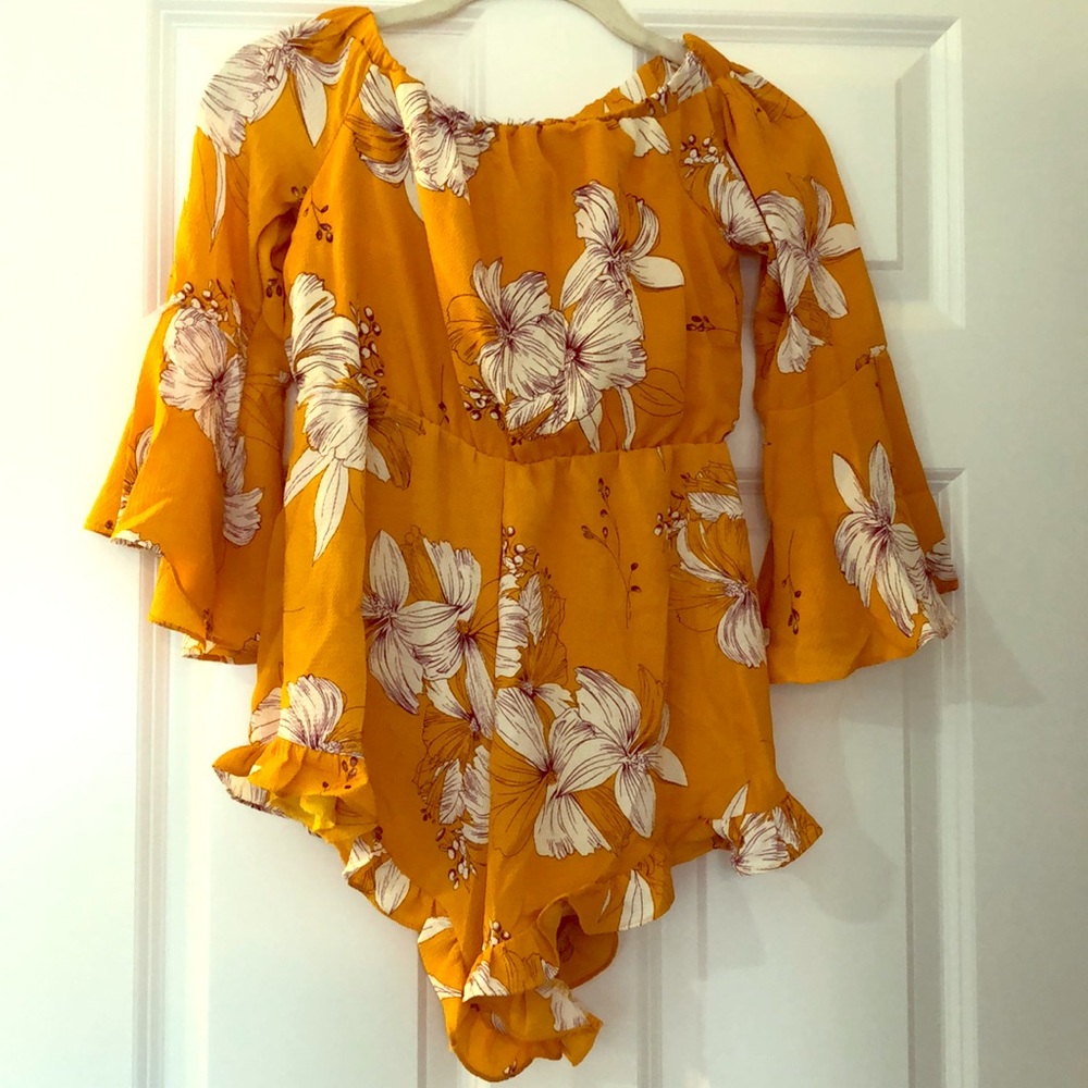 Adorable floral off the shoulder romper!